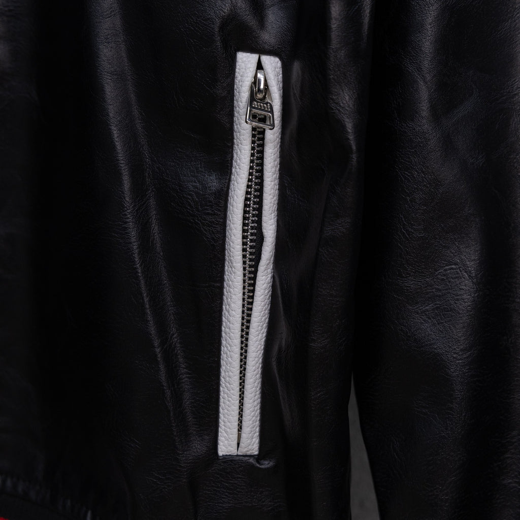 Amiri black leather jacket with zippered front pocket and silver zipper pull