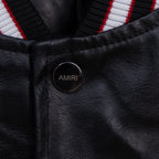 Amiri black leather jacket with round snap button branded “AMIRI”