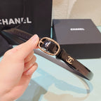 Chanel leather belt, black, with oval gold buckle and CC-logo strap detail