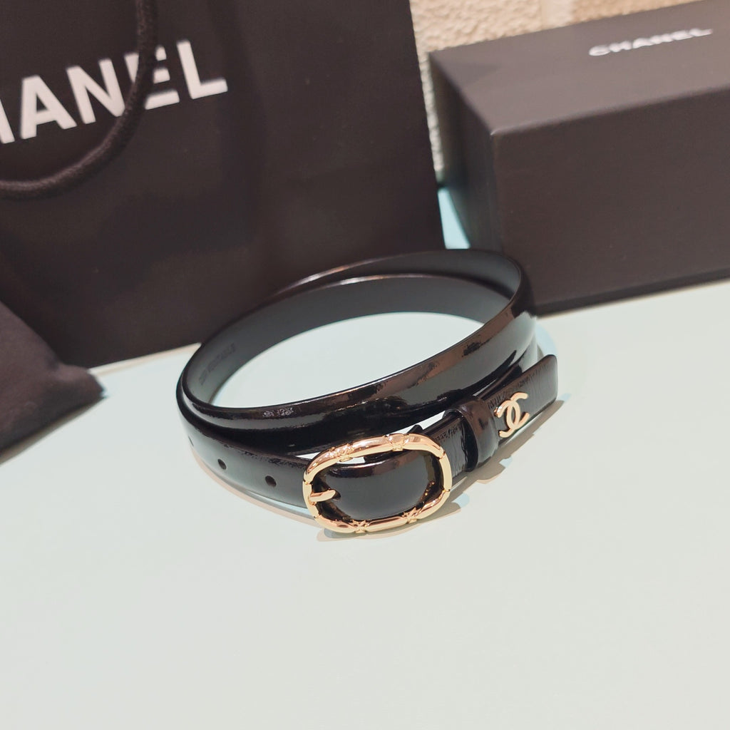 Chanel leather belt with oval gold buckle, black strap and CC-style logo