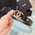 Chanel belt in dark brown leather with rose-gold double C buckle, close-up view