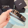 Chanel belt with dark brown leather strap and gold-toned circular buckle detail