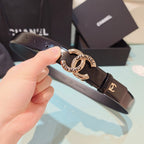 Chanel belt with dark brown leather strap and gold-toned circular buckle detail