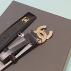 Chanel belt detail: dark leather strap with gold CC buckle and stitched edge