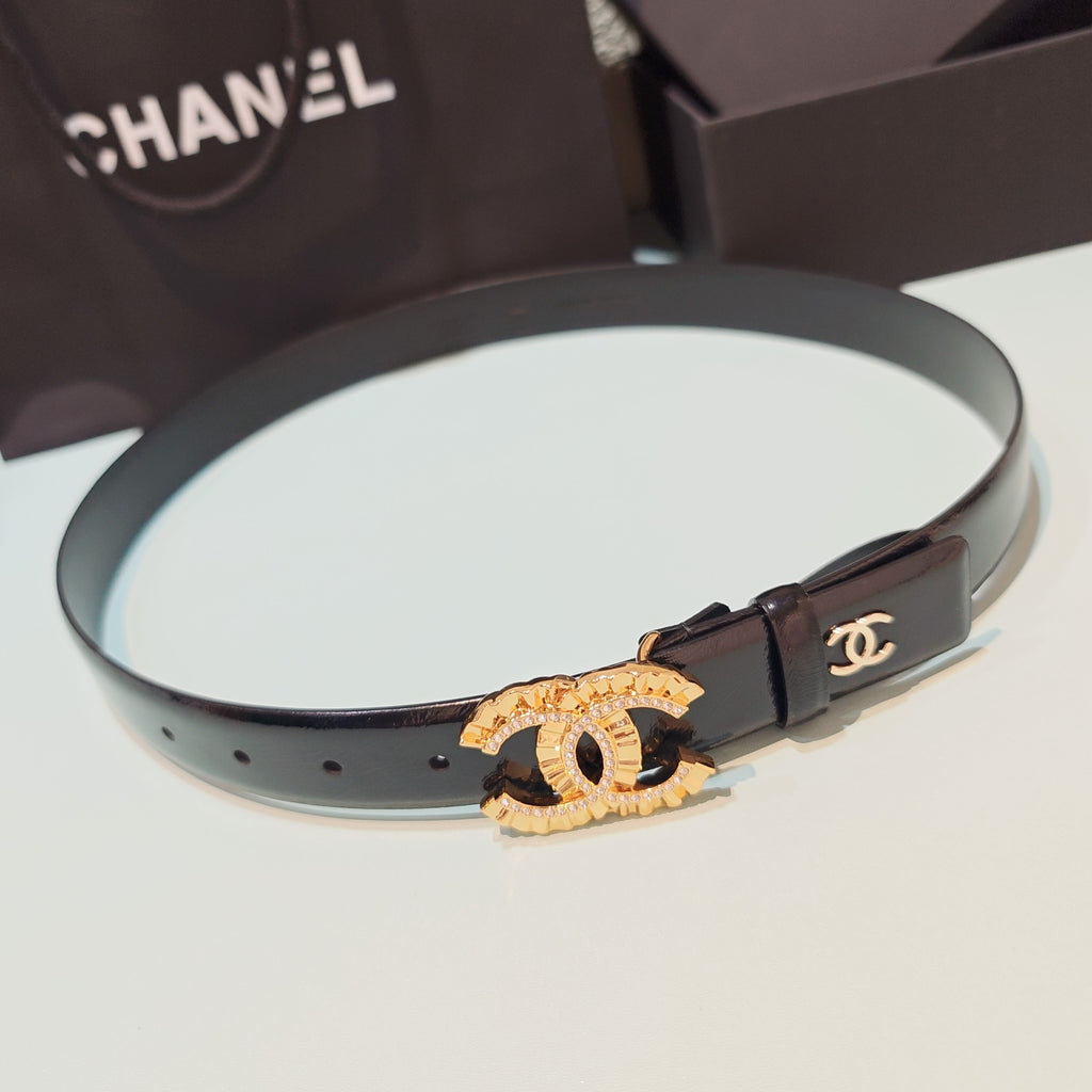 Chanel belt with dark leather strap and gold CC plaque with small stone accents