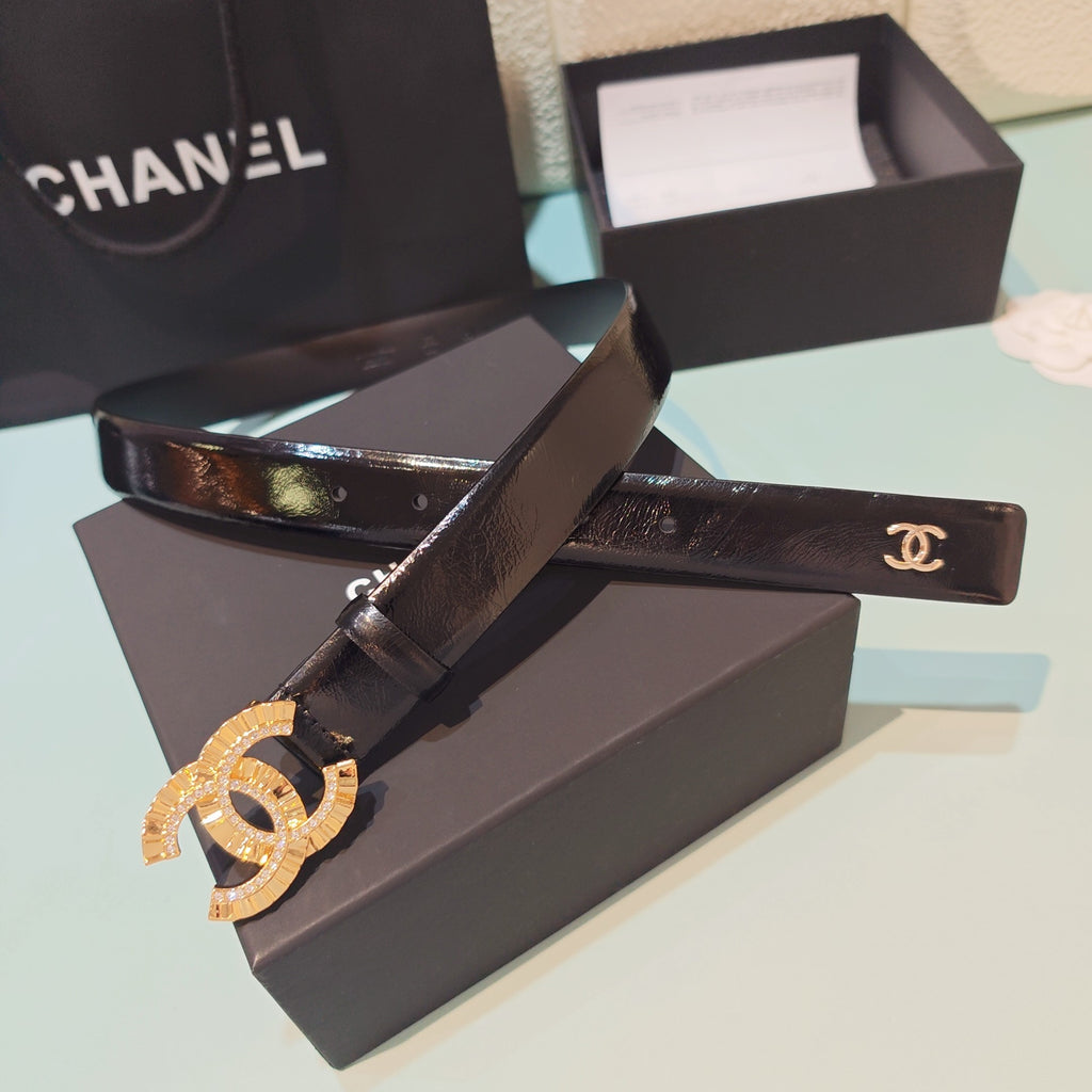 Chanel belt on box with dark leather strap and gold CC buckle clasp hardware
