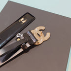 Chanel leather belt, black strap with gold-toned CC emblem and logo buckle