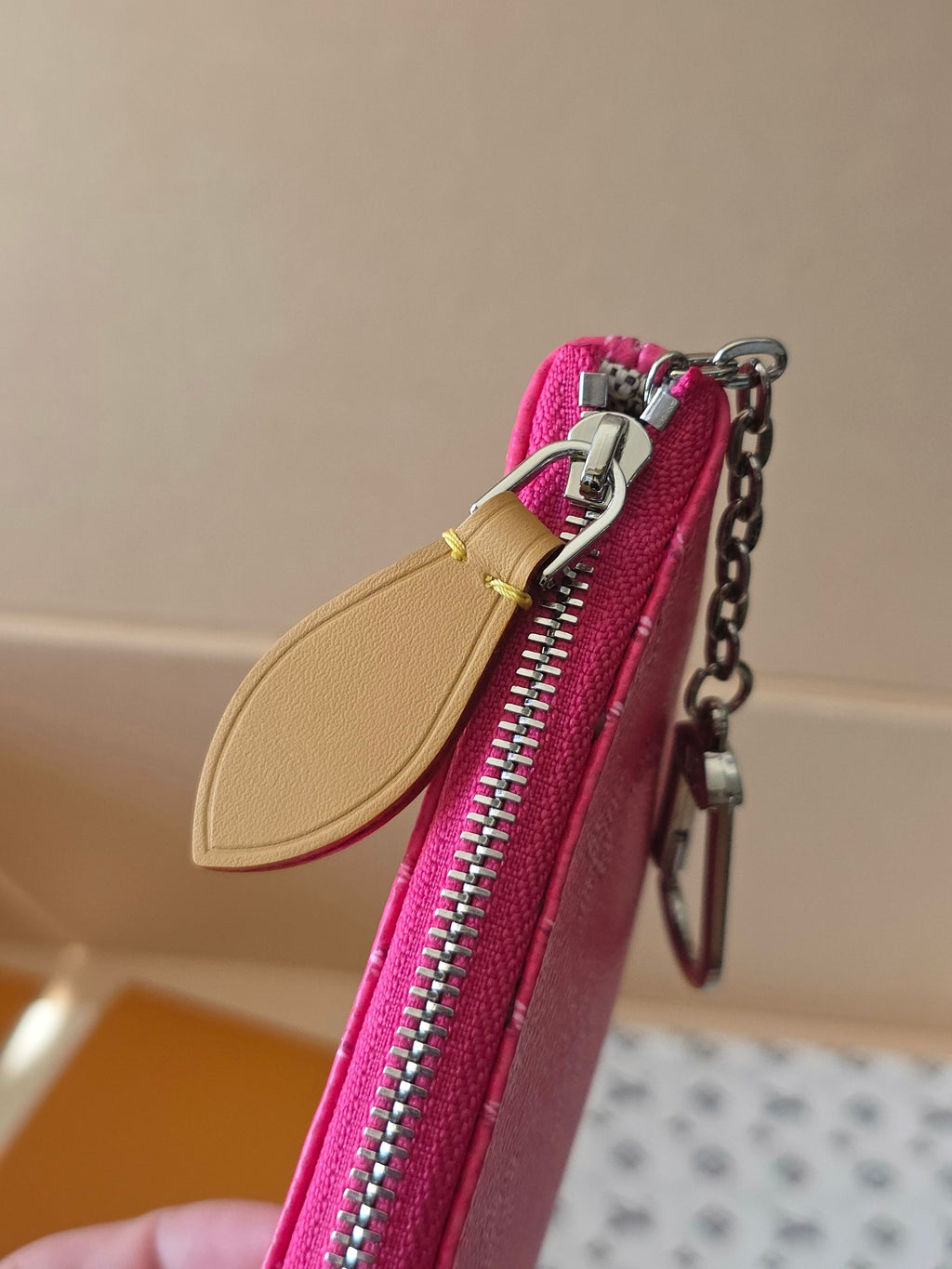 Hot pink Louis Vuitton small bag with tan leather strap and silver zipper