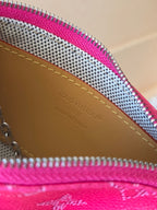 Louis Vuitton pink monogram bag interior close-up with tan leather trim and text