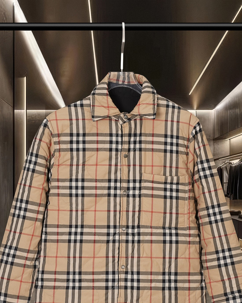 Burberry plaid jacket front upper section with button closure and dark lined collar
