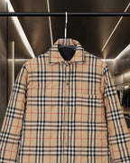Burberry plaid jacket front upper section with button closure and dark lined collar