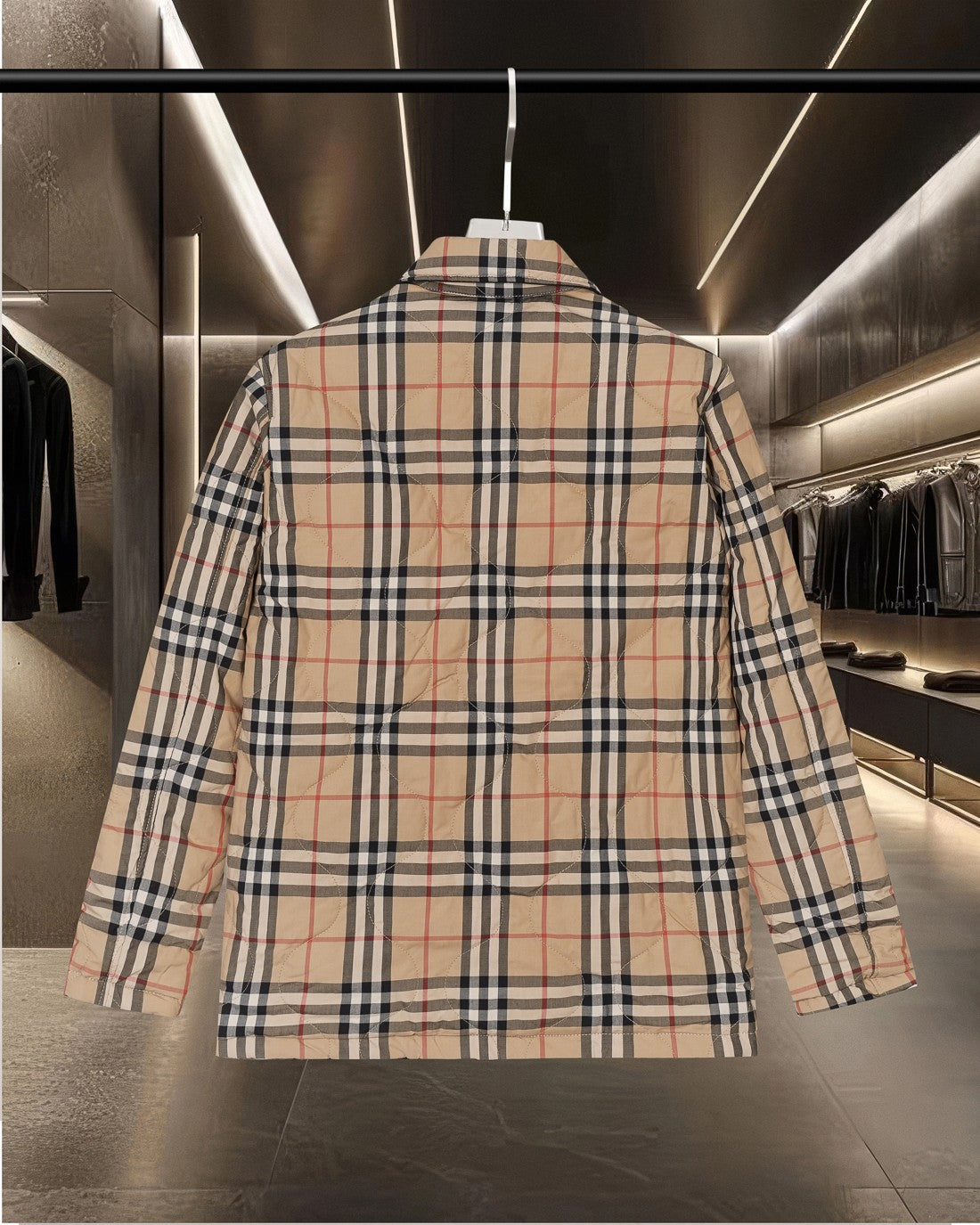 Long plaid quilted jacket back view with shoulder yoke and two-part collar.