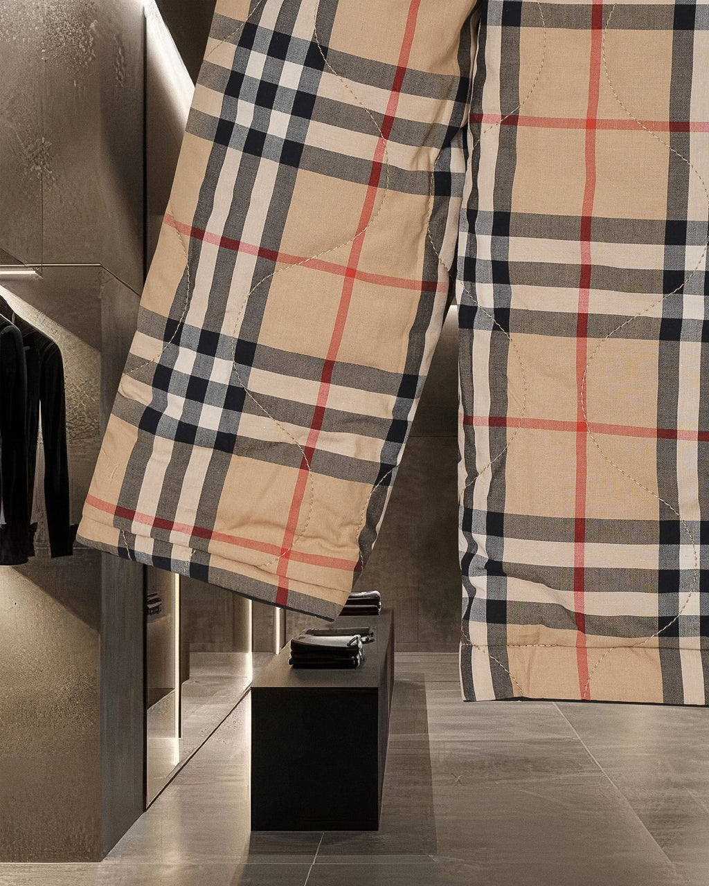 Burberry plaid jacket side view with long sleeves and buttoned front, beige black red check