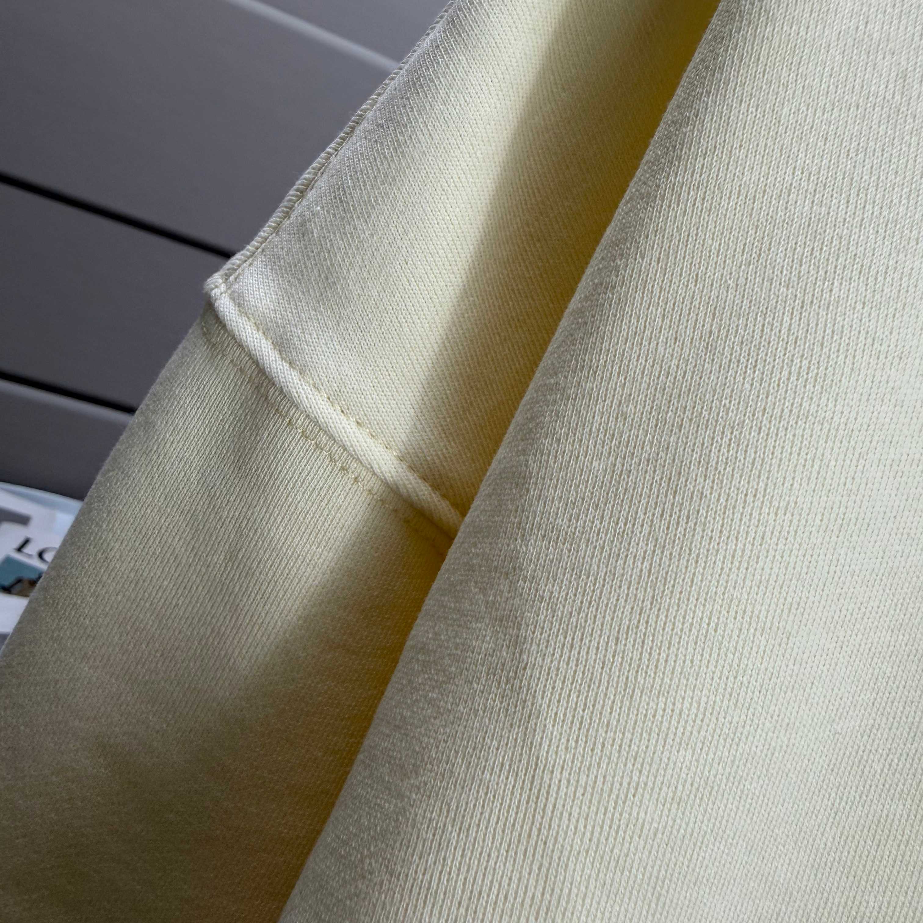 Moncler crewneck sweatshirt sleeve and cuff in light cream fabric close-up