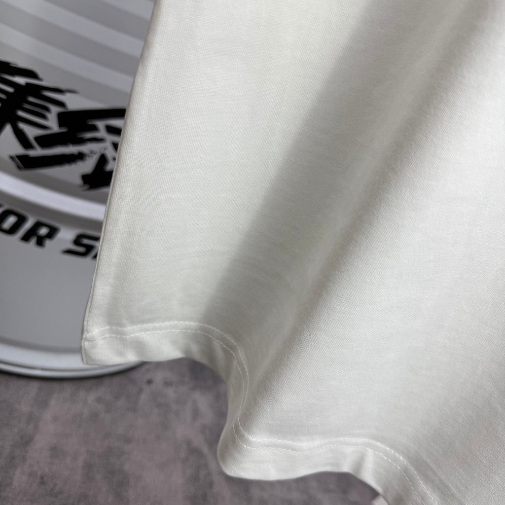 White T-shirt lower hem with double-stitched edge