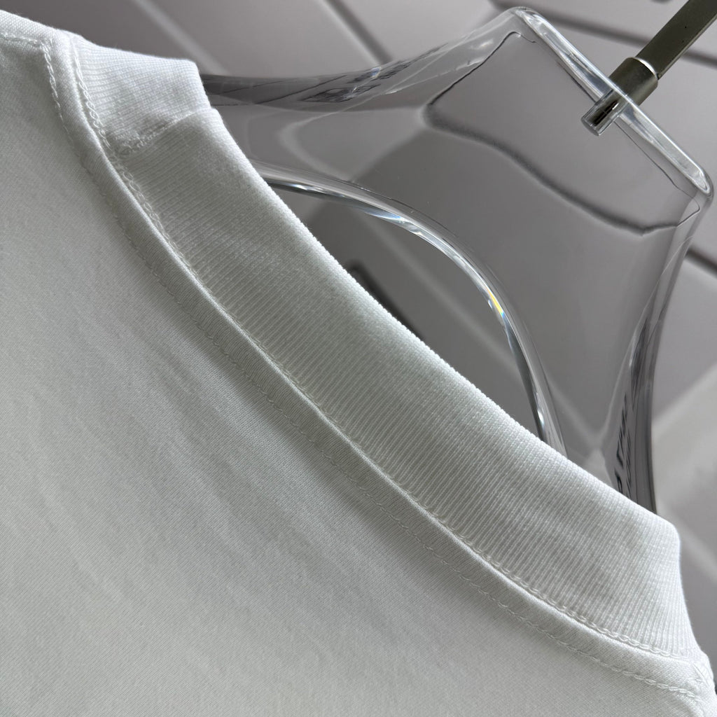 Moncler white T-shirt shoulder and collar, close-up on hanger