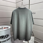 Short-sleeve T-shirt in muted gray-green, plain back view on hanger