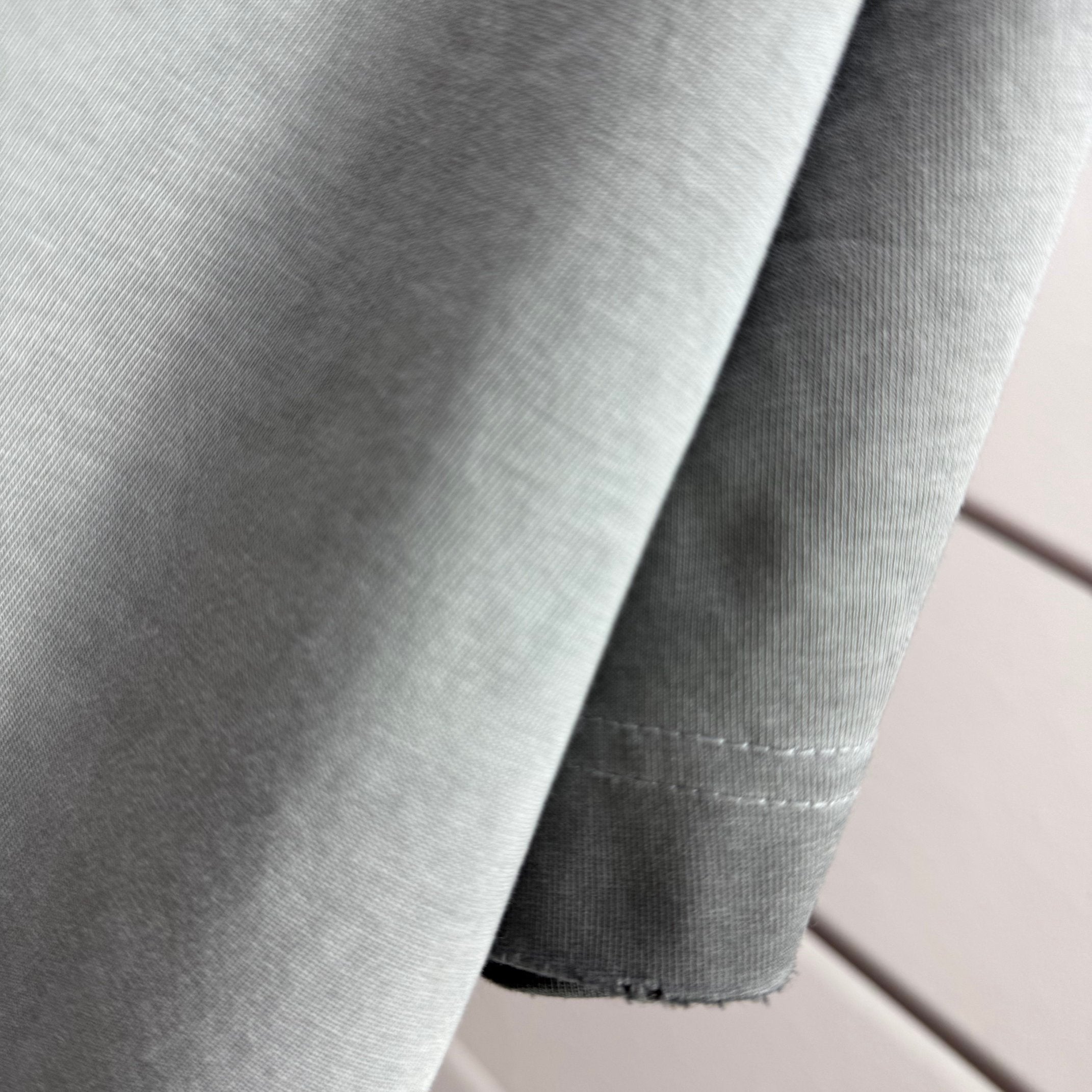 Grey T-shirt fabric with stitched seam detail