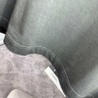 Grey T-shirt bottom hem with stitching detail