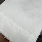 Off-white T-shirt neckline close-up with fine stitching