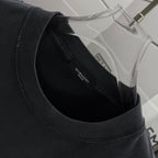 Black T-shirt crew neck with small GIVENCHY label inside collar.