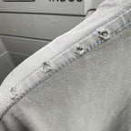 Gray T-shirt shoulder seam with stitched overlock detail