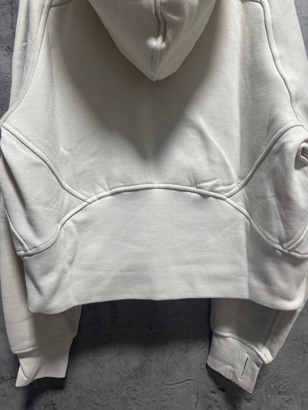 Cream zip-up hoodie with hood and kangaroo pocket on front