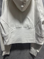 Cream zip-up hoodie with hood and kangaroo pocket on front