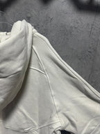 Cream hoodie sleeve and side seam with drawstring channel detail