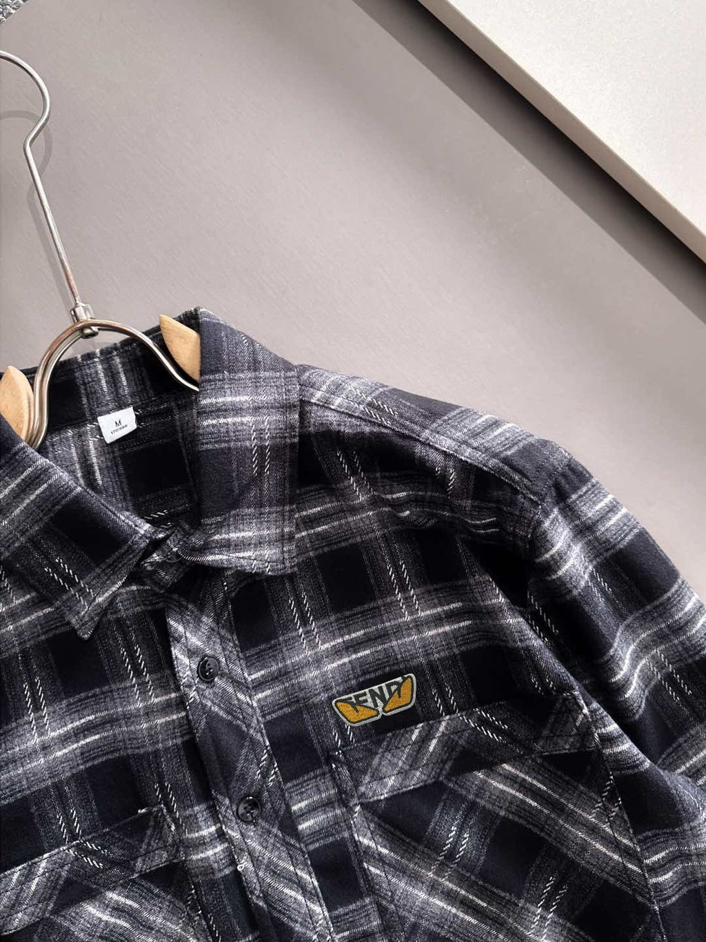 Fendi plaid long-sleeve shirt close-up, buttoned pocket and logo patch