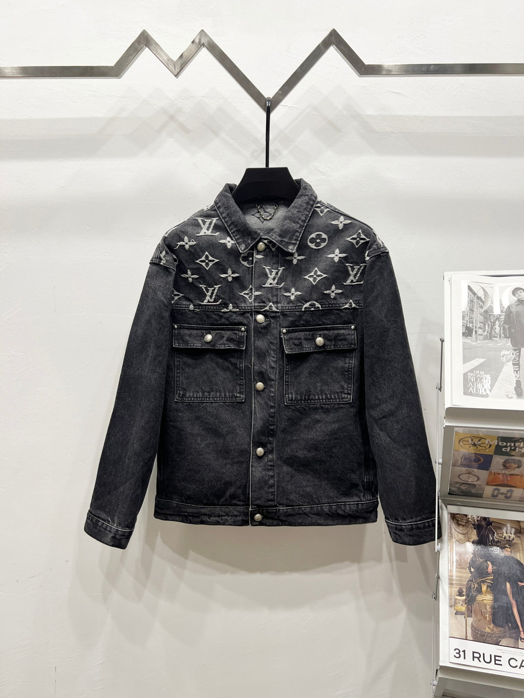 Black denim jacket with LV-style monogram print, front button closure, chest flap pockets