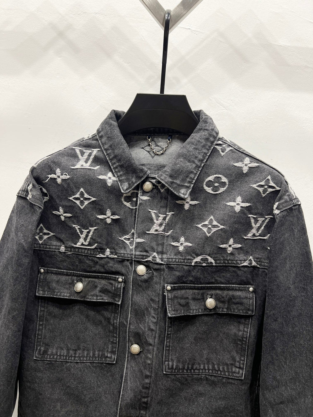 Black denim jacket with LV-style monogram print, spread collar, two chest flap pockets