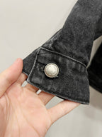 Black denim jacket sleeve cuff button detail in dark denim