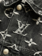Black denim jacket fabric with LV-style monogram embroidery and gold-tone metal buttons