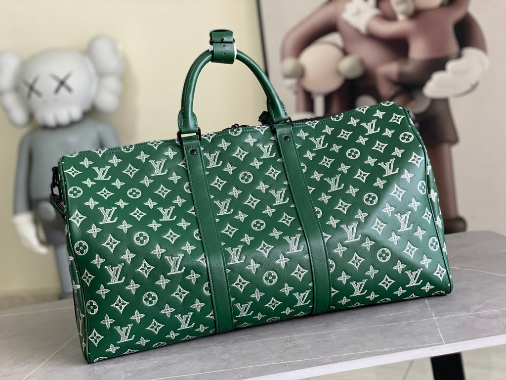Men’s Louis Vuitton green monogram duffel bag with top handles and front view