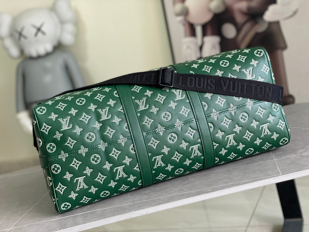 Louis Vuitton green monogram duffel bag with black strap and top handle