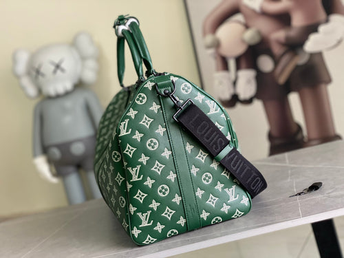 Men’s Louis Vuitton green monogram duffel bag with top handle and side strap