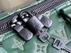 Men’s Louis Vuitton green monogram duffel bag close-up of zipper pulls and hardware