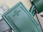 Men’s Louis Vuitton green monogram duffel bag close-up of leather corner panel