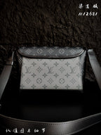 Monogram crossbody bag with wide flap, top handle straps, and front panel