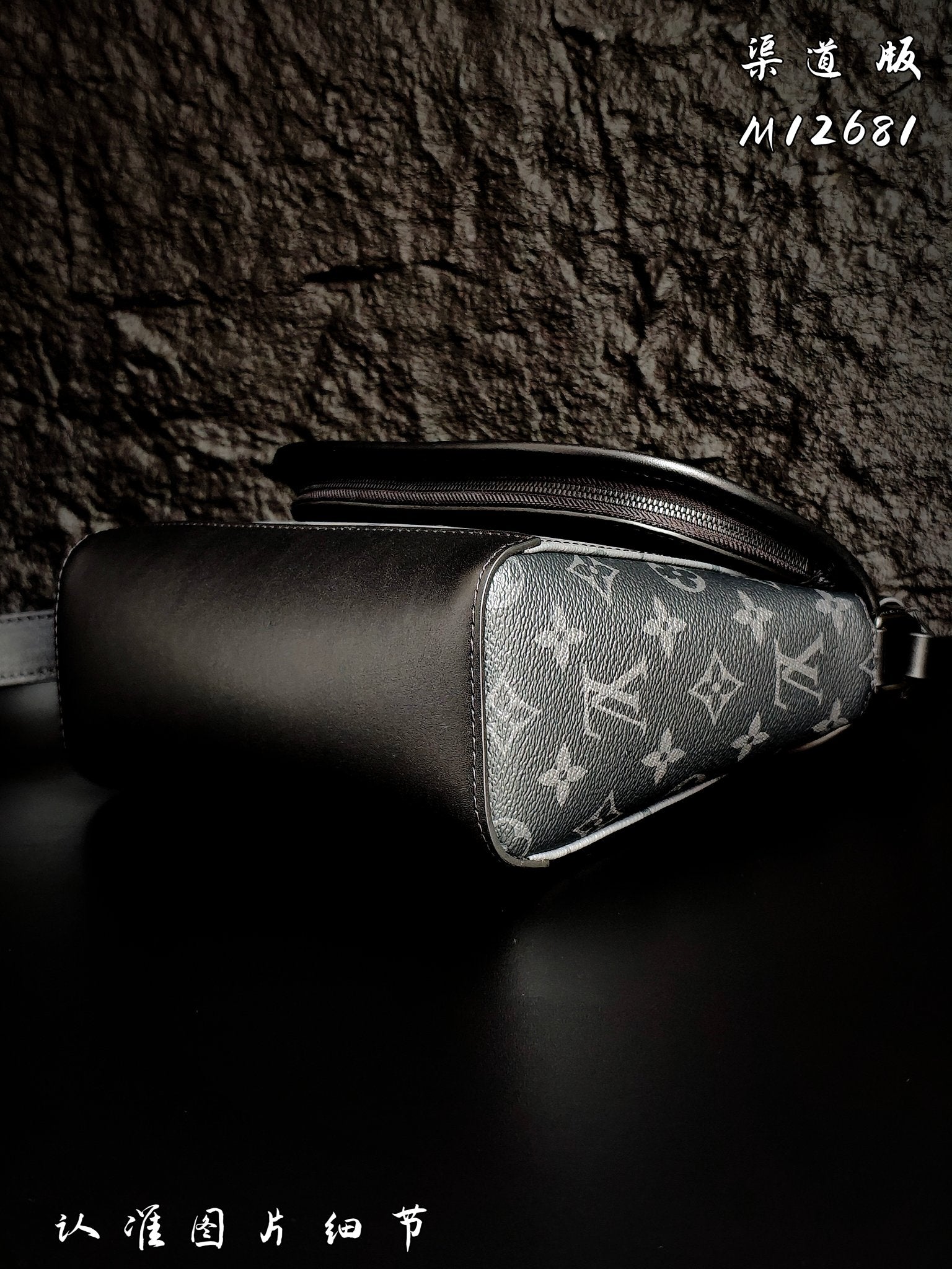 Leather and monogram crossbody bag with side zipper and curved silhouette