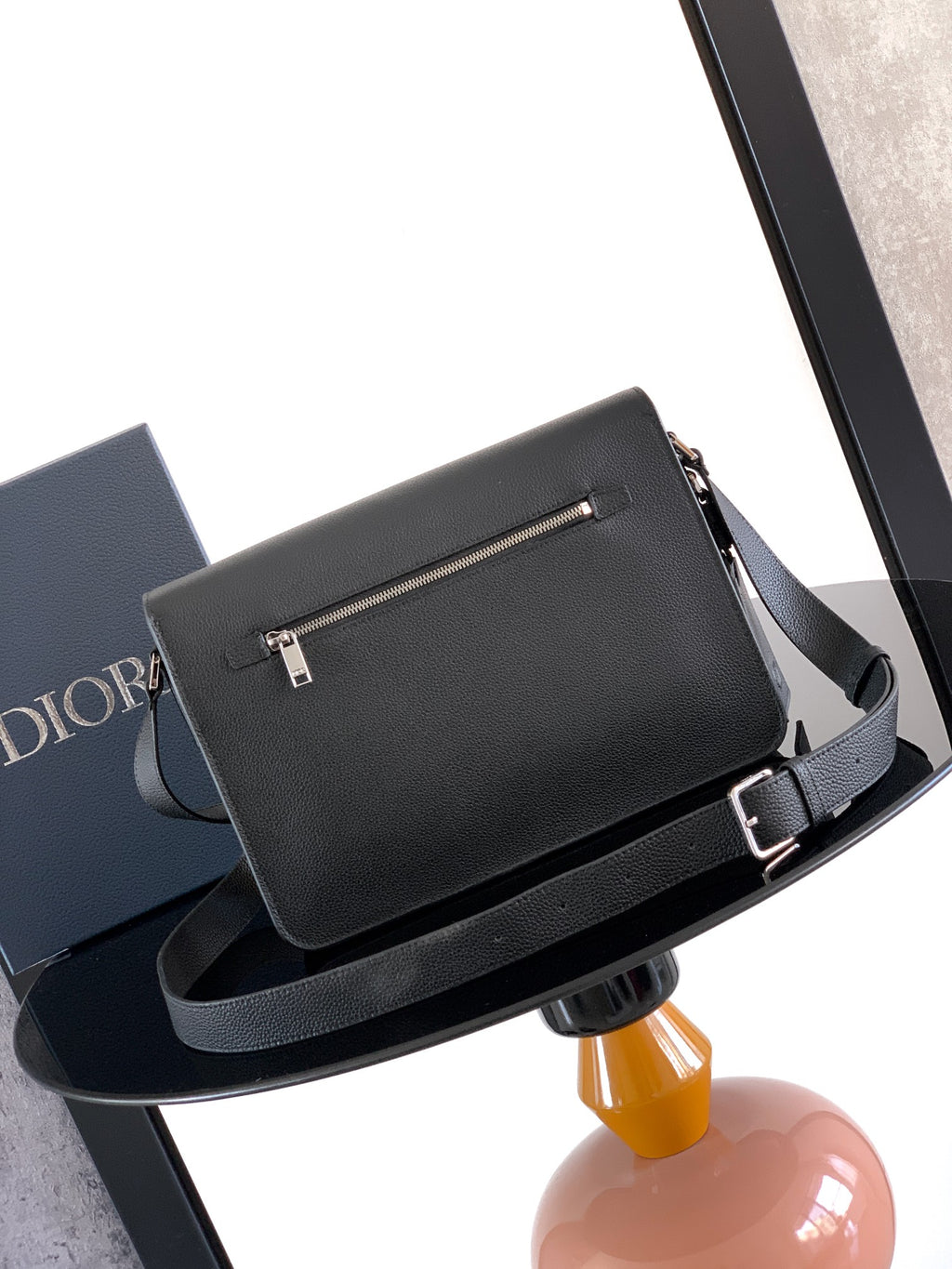 Dior leather crossbody bag with rectangular buckle strap and flap front, dark gray