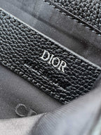 Dior leather bag interior close-up with textured lining and Dior branding