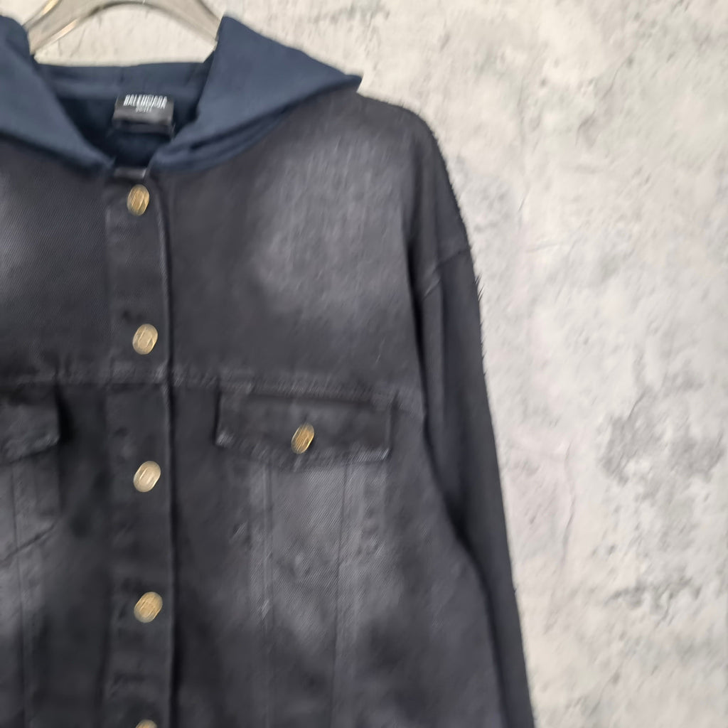 Navy hooded denim jacket front with gold snap placket and chest pocket detail.