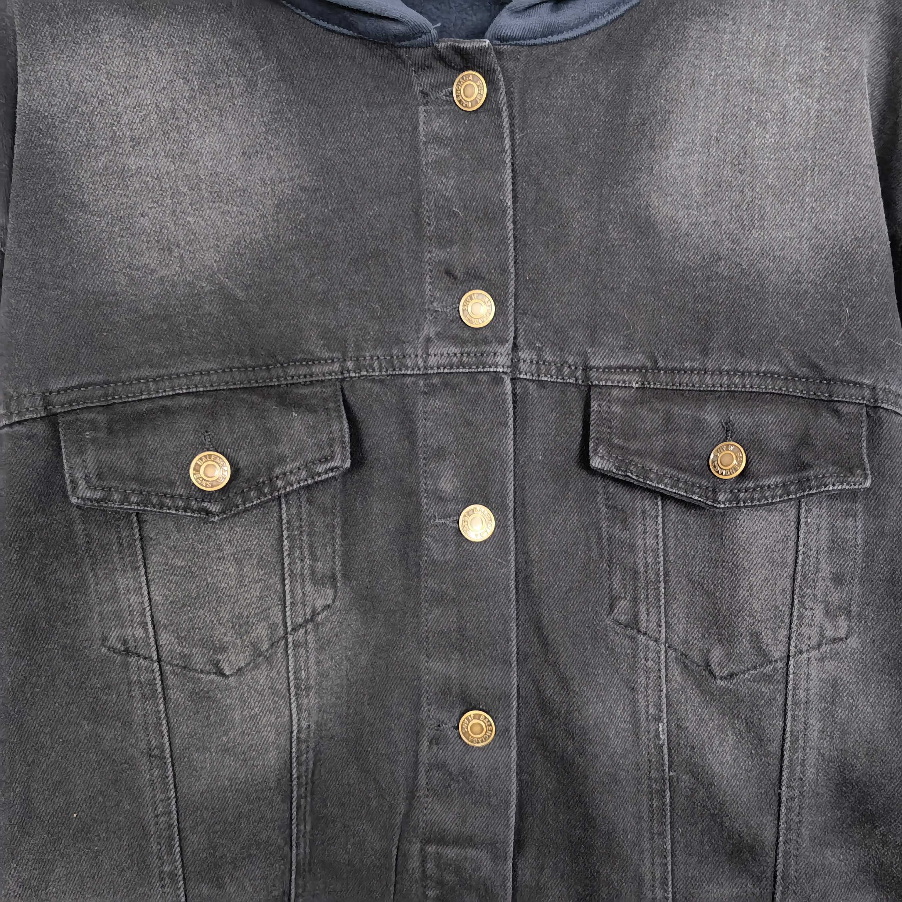 Balenciaga long denim jacket, close-up of snap buttons and flap chest pockets