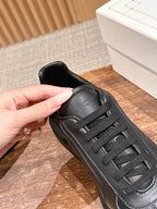 Black leather sneaker heel and collar with lace-up strap detail
