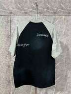 Black raglan T-shirt with heather gray raglan sleeves and small chest script