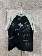 Black raglan T-shirt with heather gray sleeves and handwritten graphic lettering