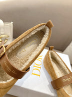 Tan suede flats with buckled strap; cream shearling lining and Christian Dior label