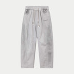 Light gray drawstring pants with elastic waistband and side pockets